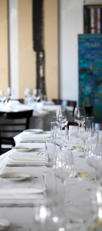 stock-photo-interior-photography-of-table-place-settings-in-a-fine-dining-restaurant-with-white-table-linen-and-1597725316